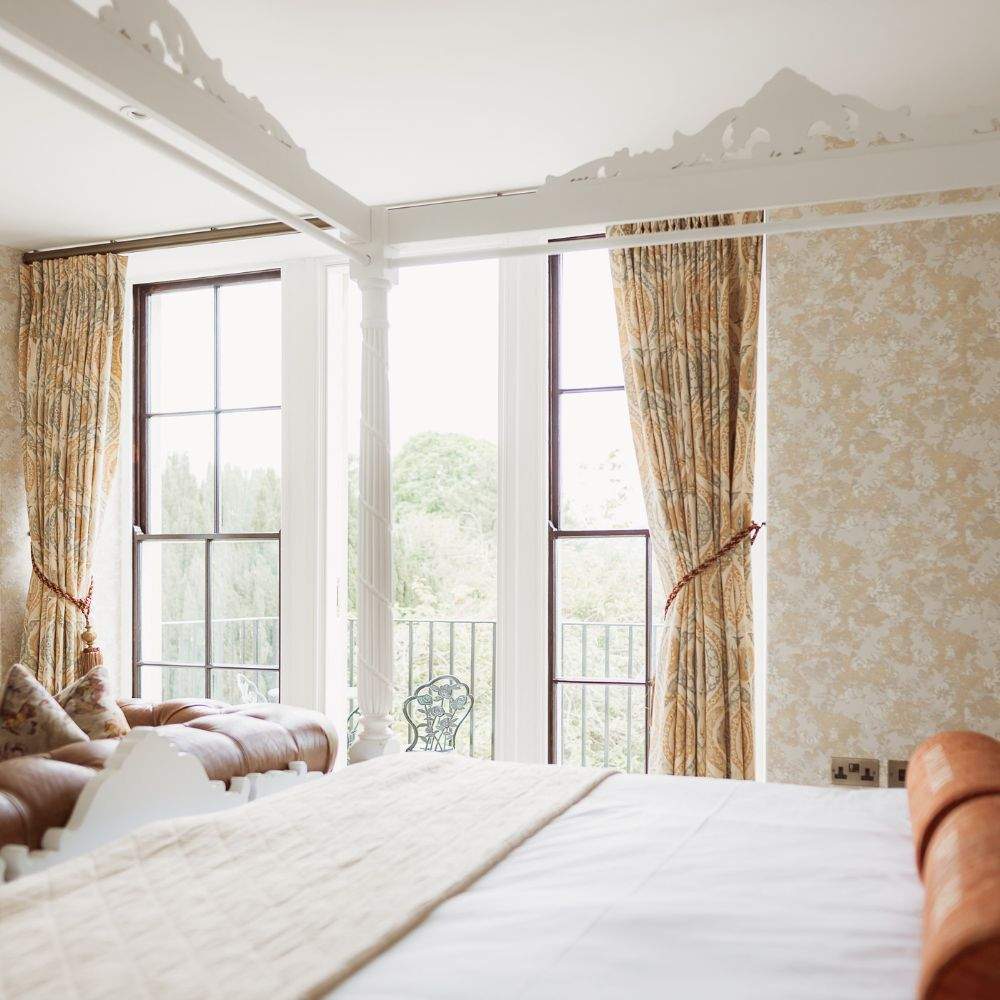 Four-poster bed in the Honeymoon Suite at Russets, a romantic wedding night stay in Surrey