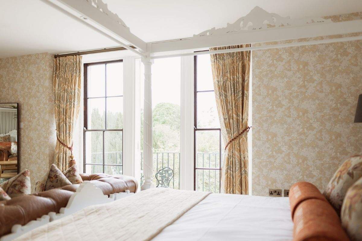 Four-poster bed in the Honeymoon Suite at Russets, a romantic wedding night stay in Surrey