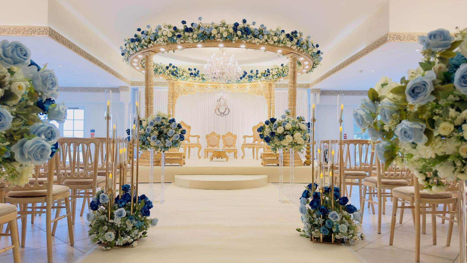 A blue & gold Asian Wedding Mandap setup in Russets's Grand Ballroom - a multi-Asian wedding venue just an hour from London on the Surrey / Hampshire border.