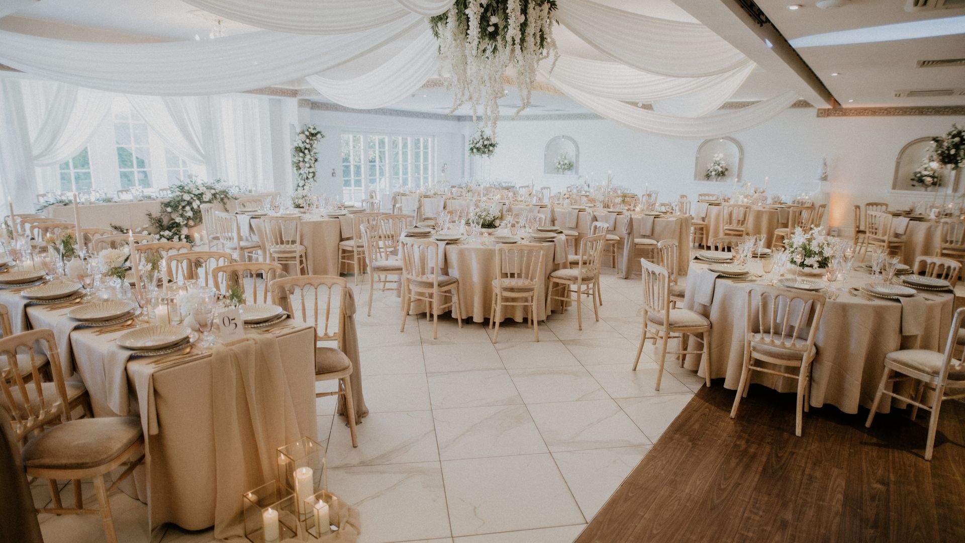 A beautiful wedding setup in Russets's Grand Ballroom, featuring elegant white draping.