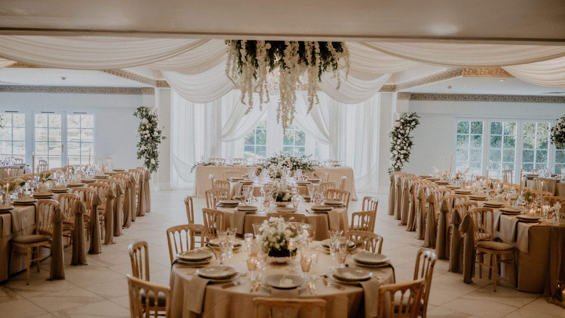 A beautiful wedding setup in Russets's Grand Ballroom, featuring elegant white draping.