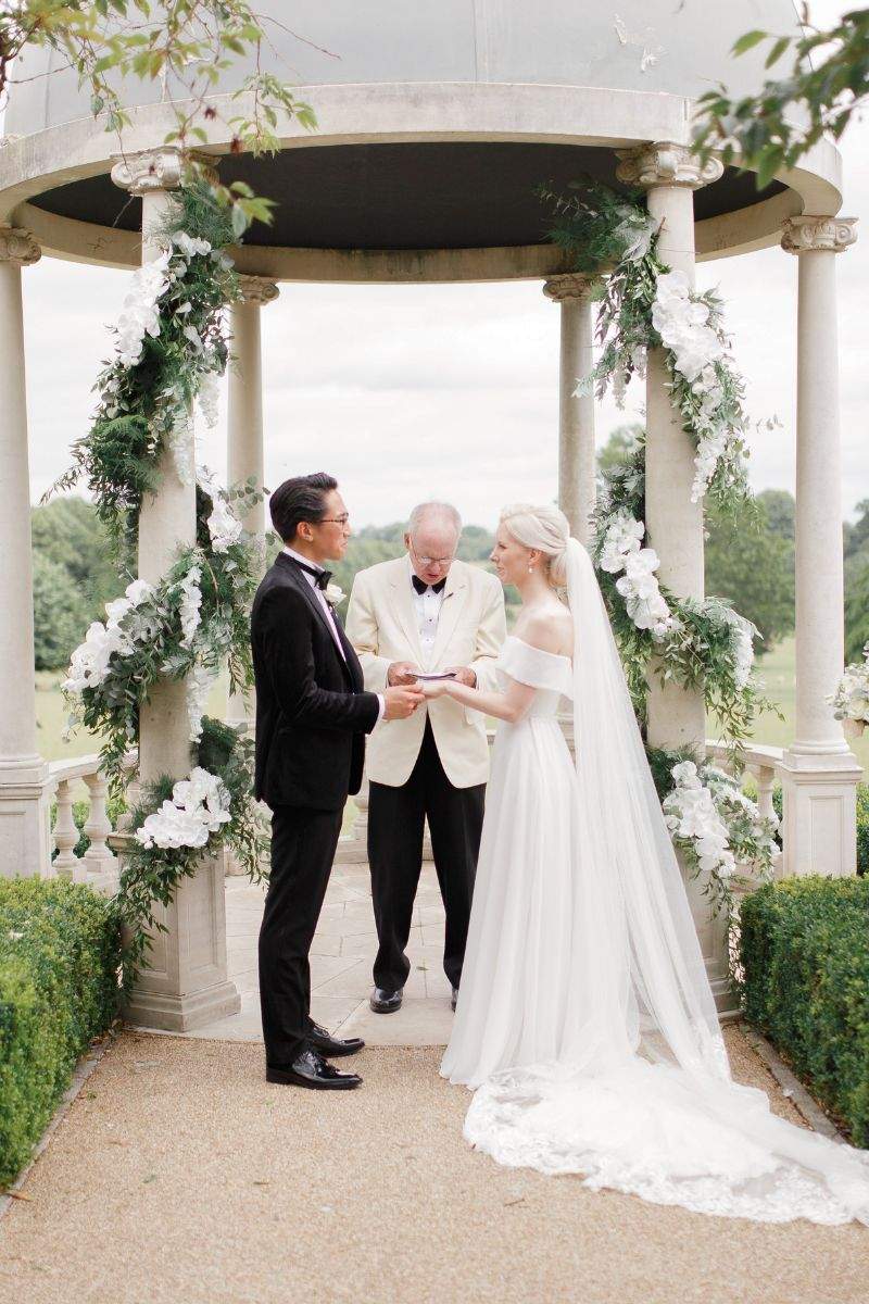 A British couple getting married at the outdoor dome at Russets in Hampshire - a top rated wedding venue that offers all0inclusive catering packages in partnership with caterer our recommended caterers.