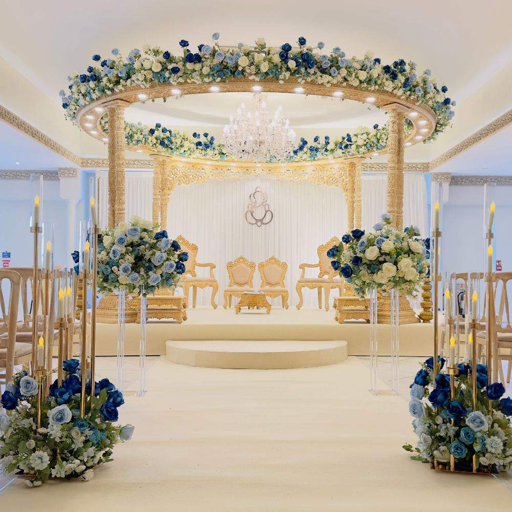 A blue and gold Mandap setup for a Hindu wedding ceremony at Russets, a leading Asian dry hire wedding venue