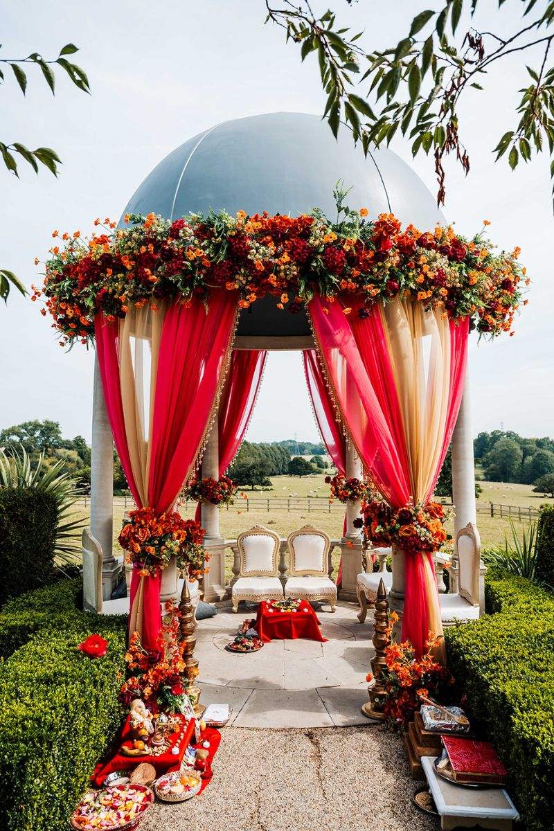 Russets in Surrey's outdoor dome setup for a colourful Asian wedding featuring a Hindu Mandap