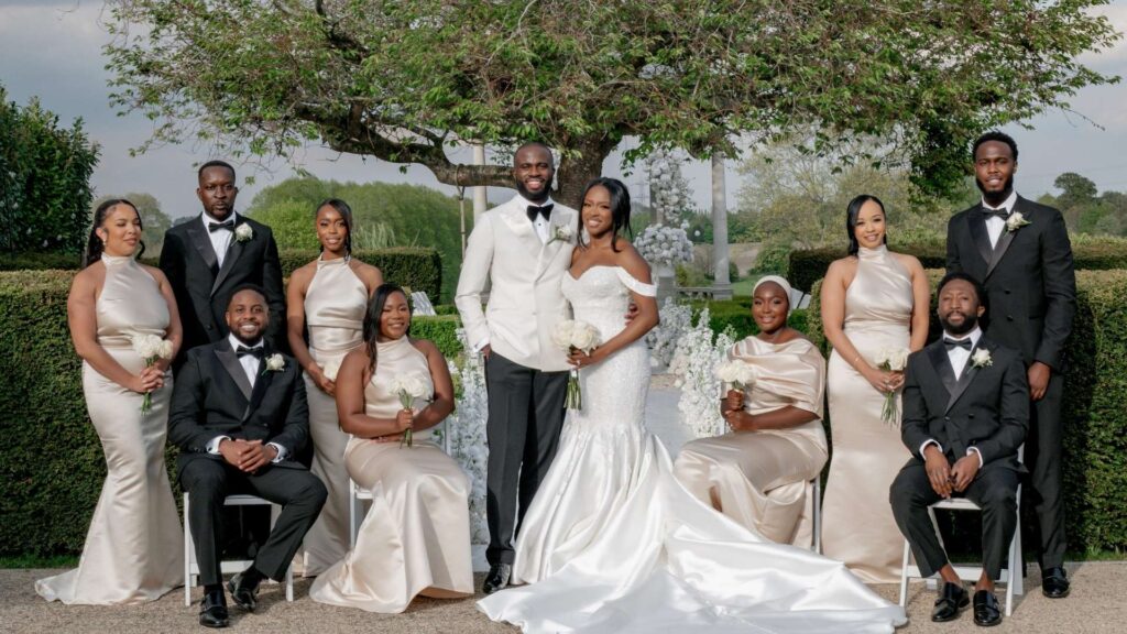 Bride and Groom with their party in the gardens at Russets