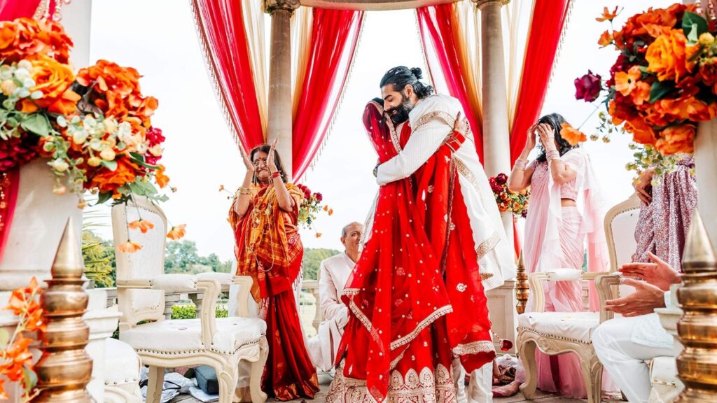 A Hindu Bride and Groom benath their outdoor Mandap at Russets